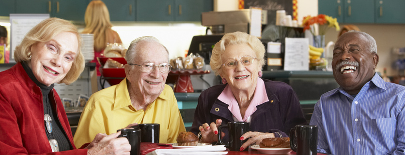 Senior adults having morning coffee together